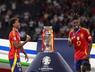 Spain's forward #19 Lamine Yamal (L) and Spain's midfielder #17 Nico Williams celebrate on the podium after winning the UEFA Euro 2024 final football match between Spain and England at the Olympiastadion in Berlin on July 14, 2024. (Photo by Adrian DENNIS / AFP)